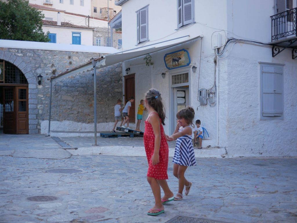 Kids playing on the streets of Hydra island, Greece