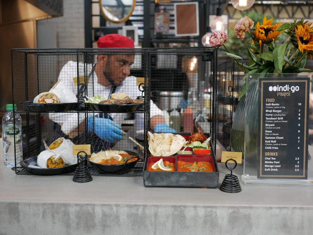 Man preparing food in the Old Spitalfields food market.