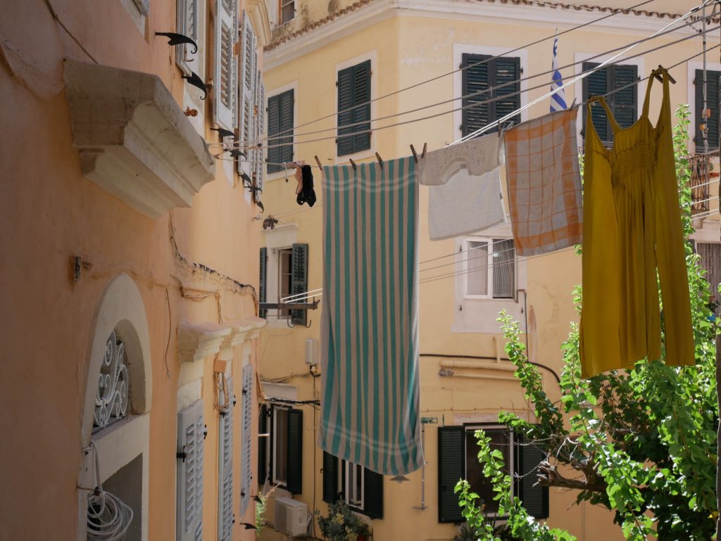 laundry hanging from balconies in Corfu town, Greece